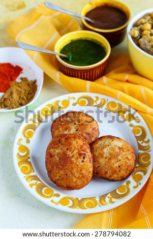 Aloo Tikki , Chat , Indian Street food\
Delicious indian deep fried potato cakes (patties) served with sweet & spicy sauce