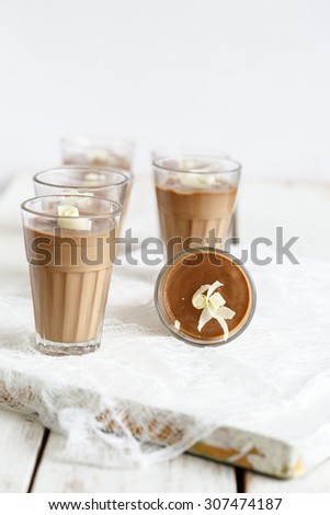 Chocolate Pannacotta , Italian Dessert\
Chocolate Panna Cotta garnished with white chocolate curls served in glasses