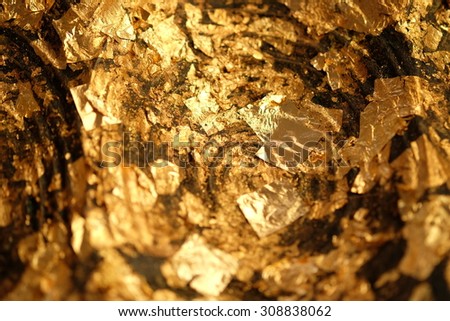 Gold Leaf ,Gold paper texture on Buddha sculpture