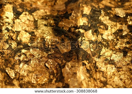 Gold Leaf ,Gold paper texture on Buddha sculpture