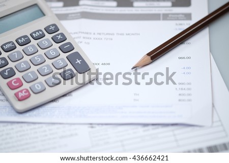 Bill and calculator with pencil, Bill of finance, Bill of electricity, Bill for medical, Macro paper bill, Bill for income and expenditure, Pencil with calculator on finance bill selective focus