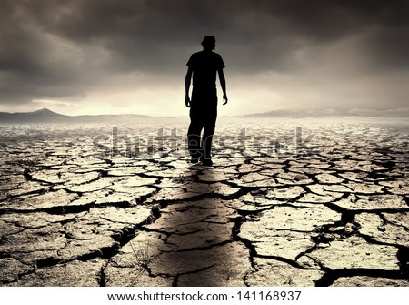 A Young Man Walks Into The Desolate Desert