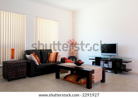 modern lounge room on Modern Lounge Room With An Orange And Brown Theme Stock Photo 2291927