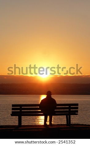 Man listening to tunes while enjoying a sunset