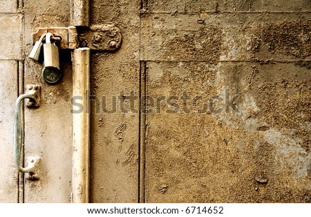 2 locks hold an old decaying door shut