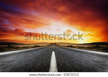 Road leading into a beautiful sunset