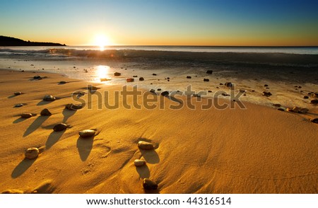 The sun sets over a beautiful Australian beach