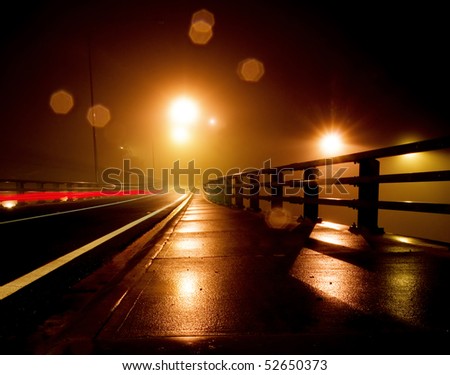 Wet and Rainy night on a bridge