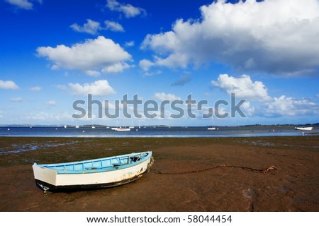 Row boat on mud flat