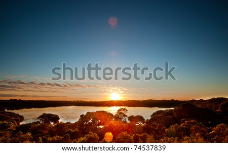 The sun rises over a peaceful lake in South Australia