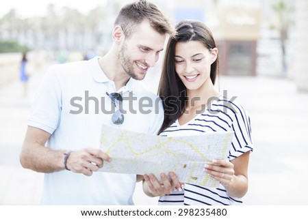 summer holidays, dating, city break and tourism concept - couple with guide