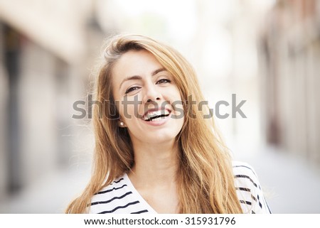 Portrait happy smiling woman outdoors