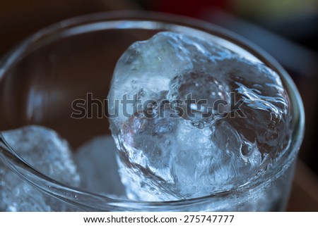 cold glass of ice. top view, soft focus.