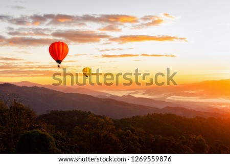 Sunset Mountain View has a floating balloon in the sky.