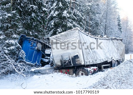 Moscow region, Russia - February, 2, 2018: the truck turned over in a ditch on a snow-covered road in Moscow region, Russia