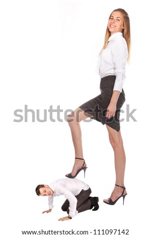 humorous image of henpecked husband stands on all fours under the heel of his wife