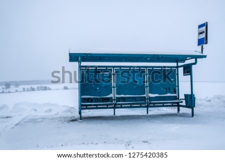 Bus station in the winter field