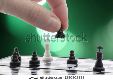 chess player plays with the pawn