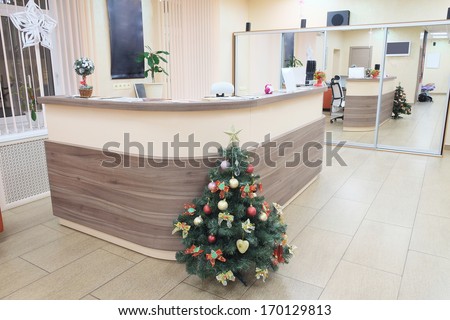 Interior of a waiting room with a table of reception