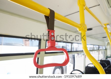 Handles for standing passenger inside a bus