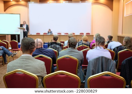 audience listens to the acting in a conference hall