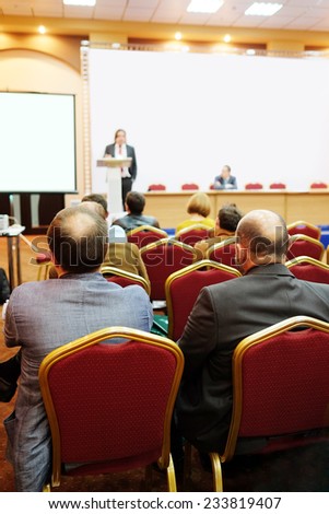 audience listens to the acting in a conference hall