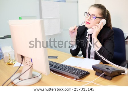 Girl secretary in an office