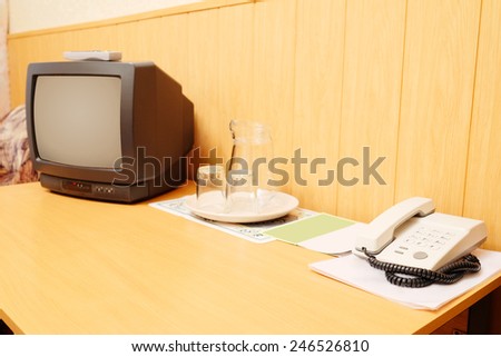 TV and a telephone on the table