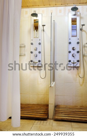 Two showers with hydro massage jets