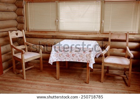 Relaxation room in the sauna. Wooden table and two chairs