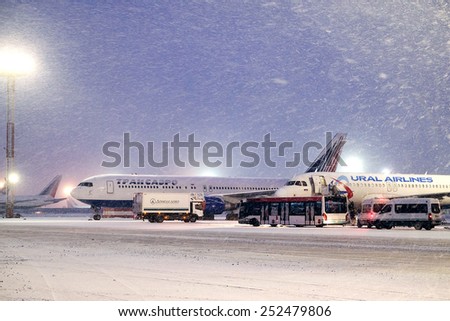 Moscow, Russia, February, 09,2015: commercial airplanes parking at the airport in winter