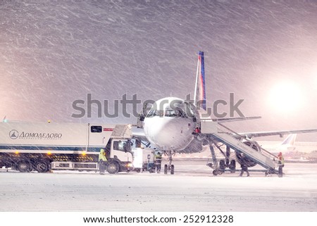 Moscow, Russia, February, 09,2015: commercial airplane parking at the airport in winter