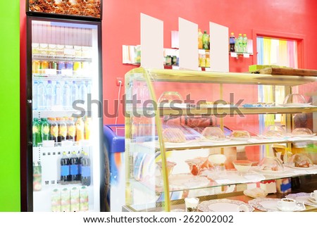 Commercial refrigerator to store drinks and tasty desserts in cafeteria