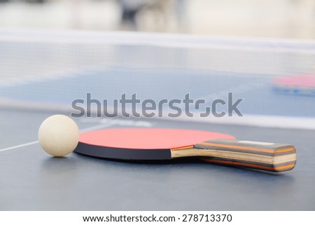 Bat for tennis and a ball