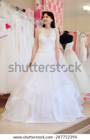 Young girl tries on a wedding dress