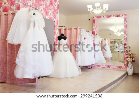 Wedding dresses in a show-room of a wedding salon