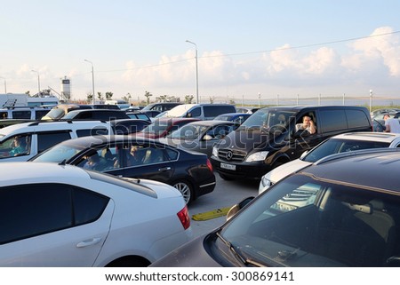Russia, Caucasus Port, July, 14, 2015: hundreds of cars gathered in turn on a ferry through the Strait of Kerch from the Russian Port Caucasus to the Crimea. Expectation lasts for many hours