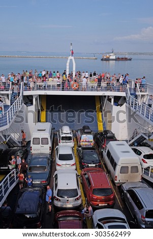 Russia, Caucasus Port, on July 14, 2015: cars on the ferry, transporting them through the Strait of Kerch from the Russian port Caucasus to the Crimea.