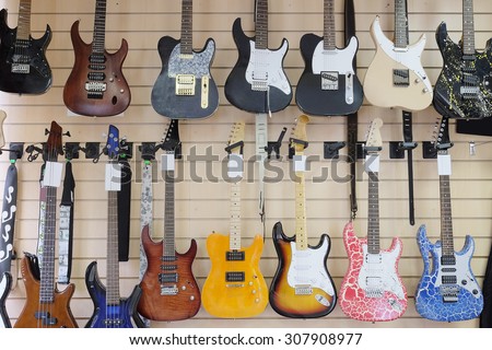 The image of guitars on a show-window of musical shop