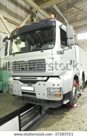 The image of a truck under repair