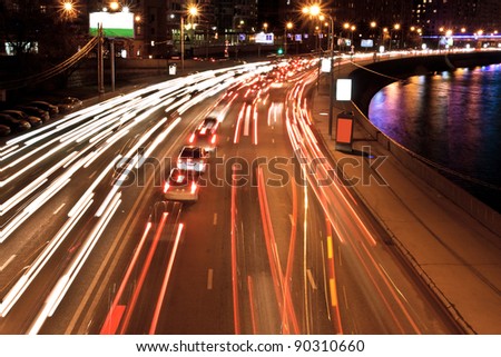The image of night traffic jam on city embankment in Moscow