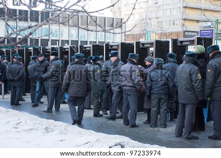 MOSCOW - MARCH 10: Police cordon on a participants of the protest manifestation against falsification of the president election, Noviy Arbat in Moscow. March, 10, 2012 in Moscow