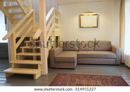 room with a sofa and stairs