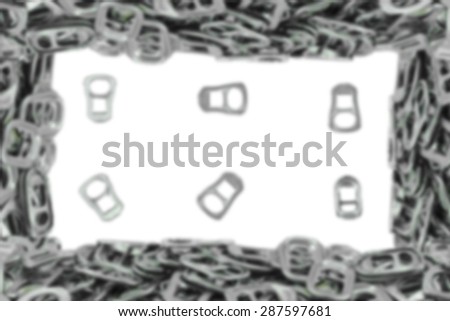 Abstract blurred, frame metal ring pull for can opener isolated on white.
