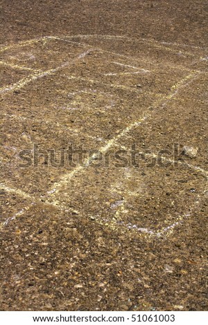 Chalk drawing of hopscotch children\'s game on pavement