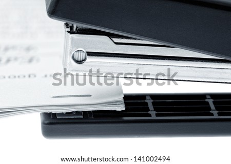 Stapler attach a documents. Isolated on a white background.