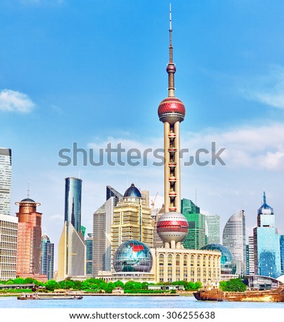 SHANGHAI-MAY 24, 2015 Oriental Pearl Tower on  blue sky background.Tower  470 meter the Oriental Pearl is one of Shanghai\'s tallest buildings, at Lujiazui finance and trade zone in Pudong district.
