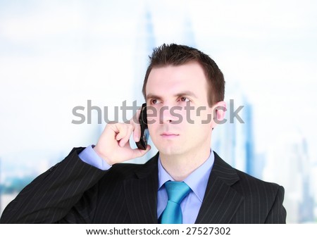 Cheerful young businessman  with cell phone-  see a future. Isolated