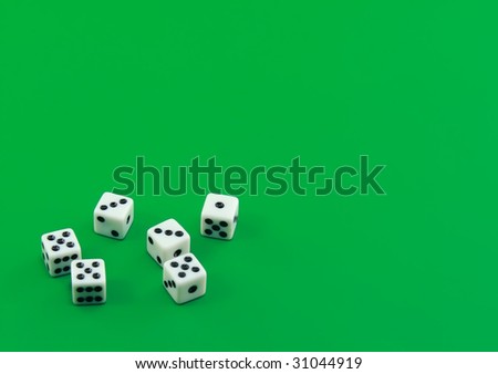 The dice on green background