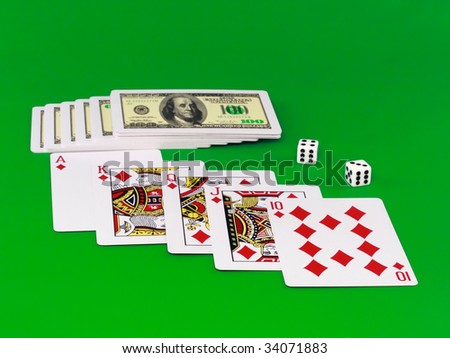Royal flesh- playing cards on green broadcloth (background).